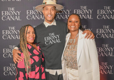 Takiyah Durham, Director of First Steps and Beyond, Emmai Alaquiva, Director of The Ebony Canal, and Nicole Keels-McGruder, CEO and Founder of Community Hero PA are posing at the Philadelphia red carpet Ebony Canal Screening.